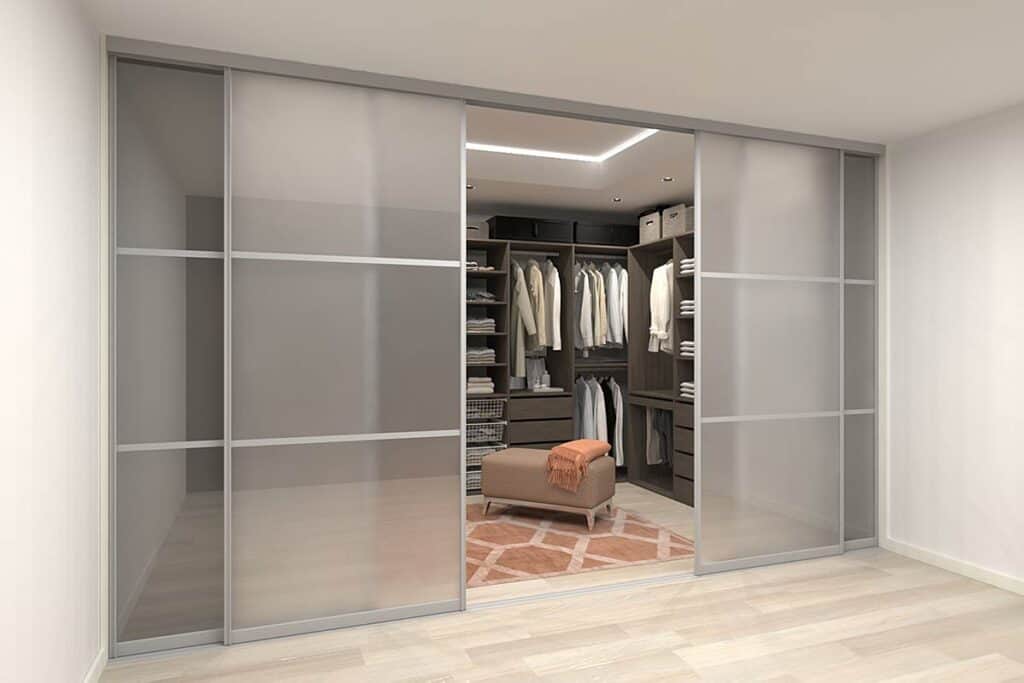 Custom wardrobe with sliding doors for organized storage.