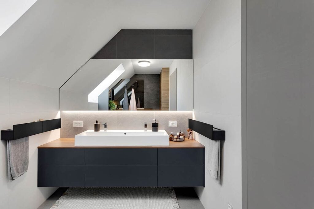 Modern bathroom with sleek cabinetry and minimalist design.