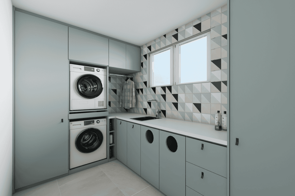 Modern bathroom with laundry appliances and stylish geometric wall tiles.