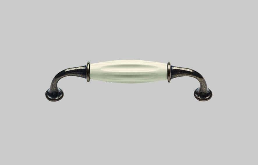 Antique metal drawer handle with ceramic grip, ideal for bespoke furniture projects.
